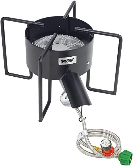 A black propane burner stove with a hose and regulator attachment.